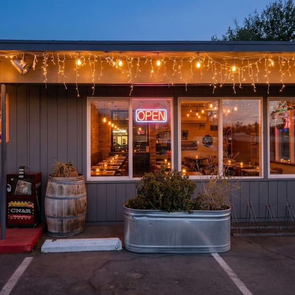 Exterior of Farm Star Pizza at dusk, with an "OPEN" sign glowing in the window.